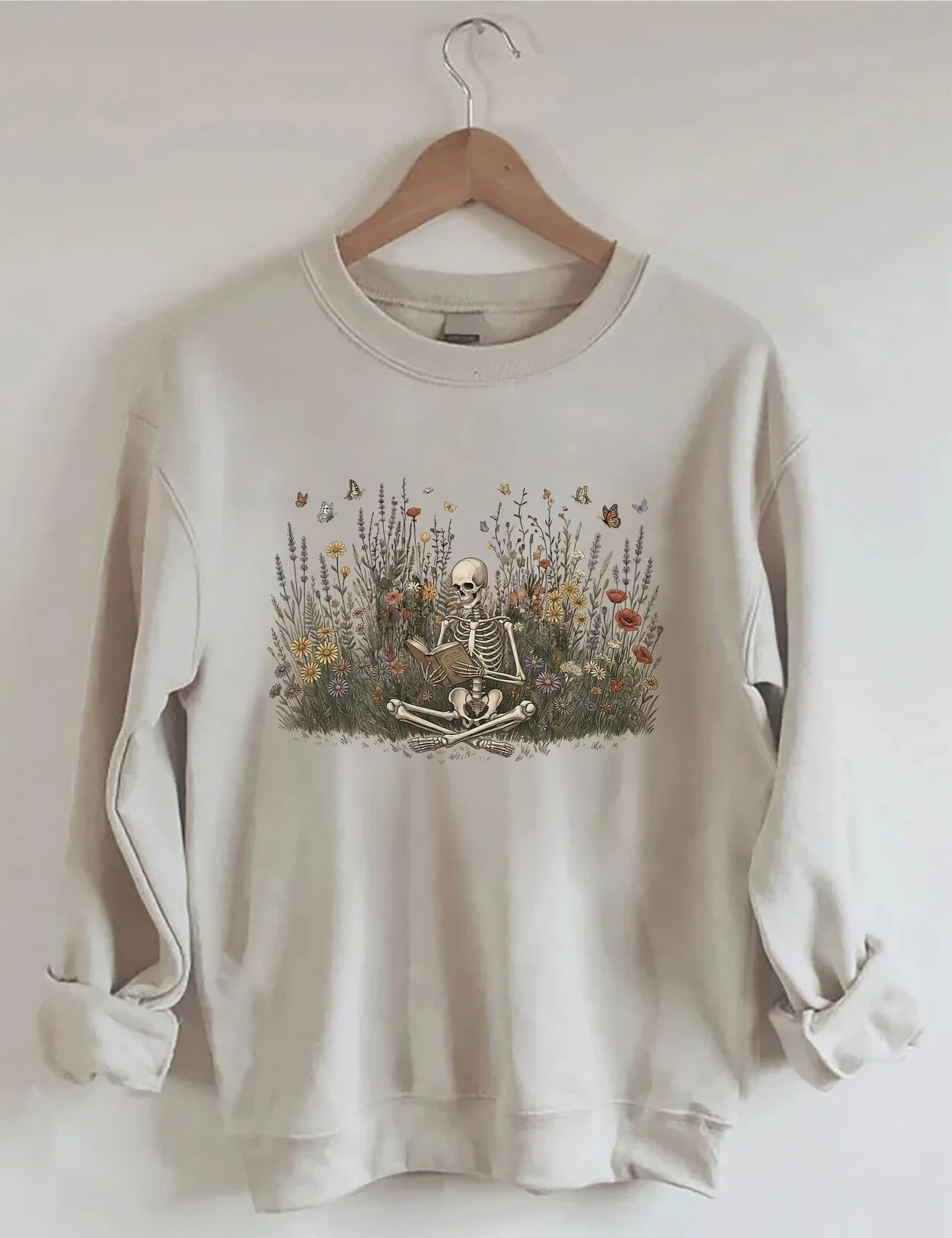 Skeleton Reading Book In Wildflowers And Butterflies Sweatshirt